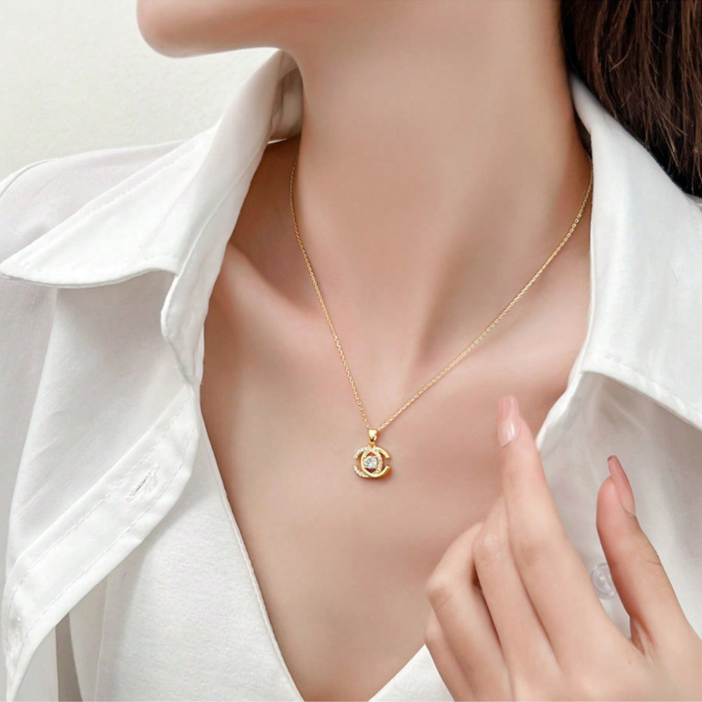 Elegant Gold Tone Interlocking C Pendant Necklace With Sparkling Cubic Zirconia – Luxury-Inspired Design Featuring Timeless Interlocking "C" Shape Adorned With Dazzling Stones, High-Quality Gold Finish, Hypoallergenic And Comfortable For Everyday Wear, Pe