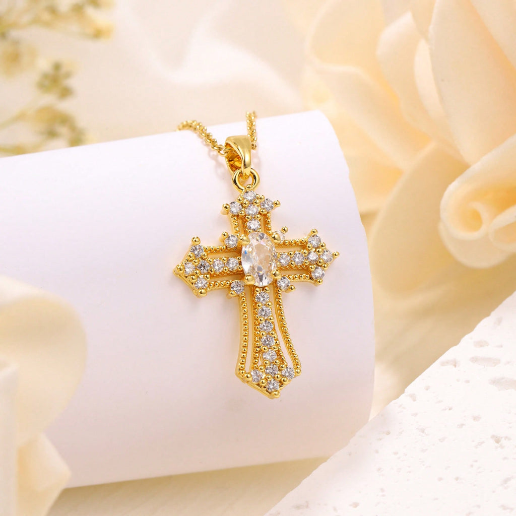 Elegant Gold Tone Cross Pendant Necklace With Sparkling Cubic Zirconia – Exquisite Religious Jewelry Featuring Ornate Cross Design Adorned With Brilliant Cubic Zirconia Stones, Including A Larger Oval Center Stone – High-Quality Gold Tone Finish For Timel