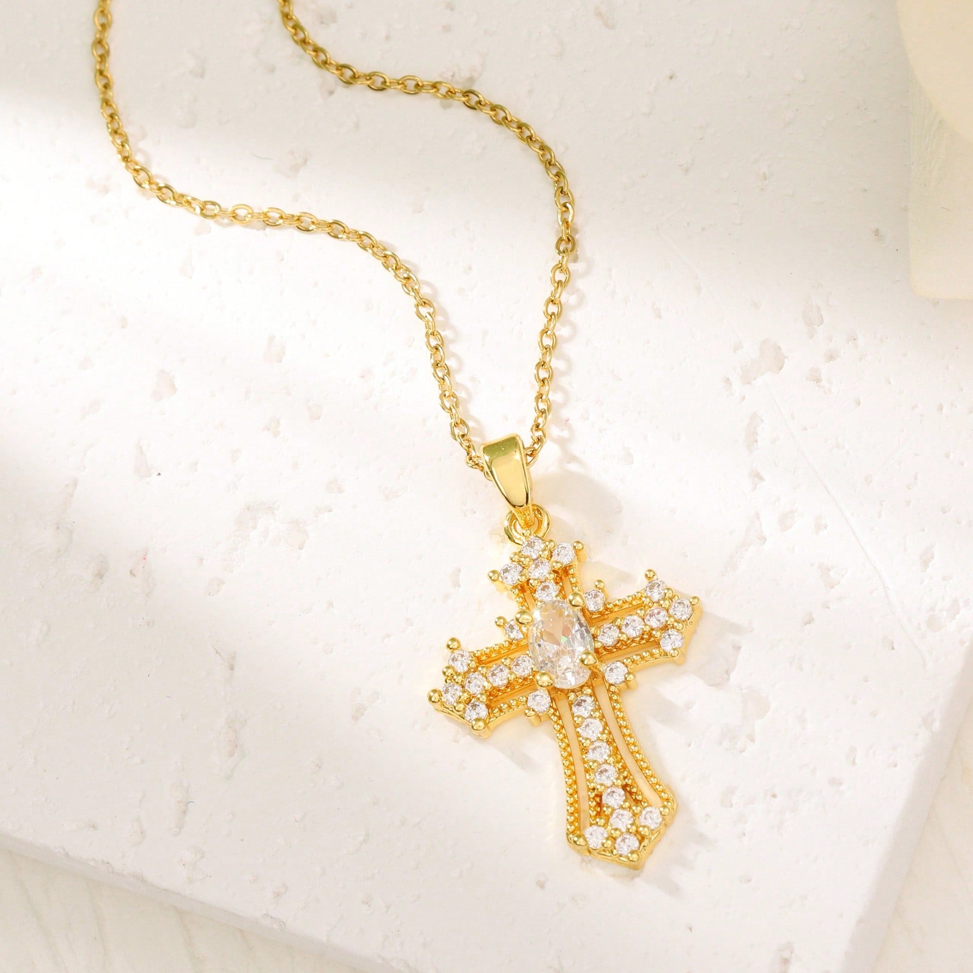 Elegant Gold Tone Cross Pendant Necklace With Sparkling Cubic Zirconia – Exquisite Religious Jewelry Featuring Ornate Cross Design Adorned With Brilliant Cubic Zirconia Stones, Including A Larger Oval Center Stone – High-Quality Gold Tone Finish For Timel