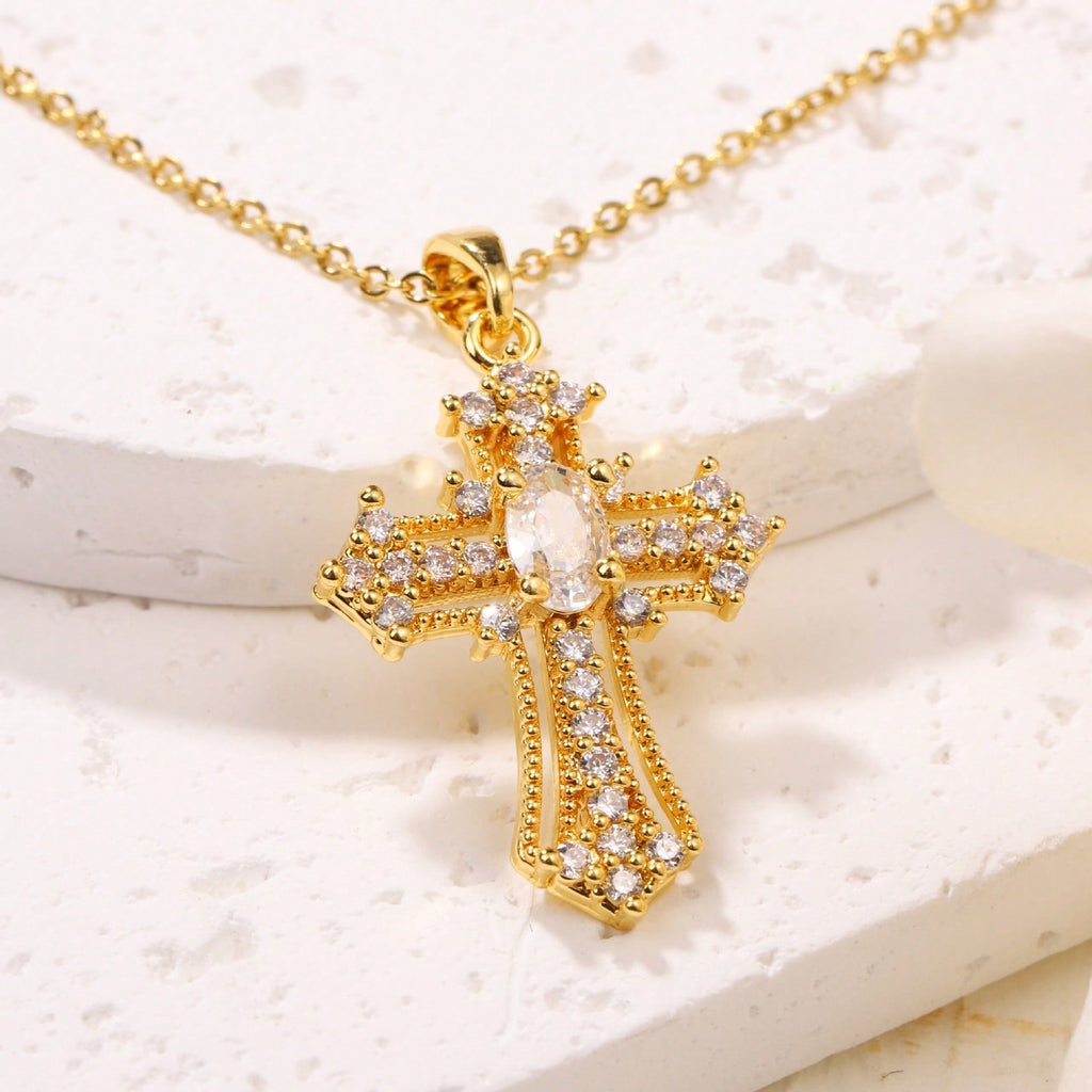 Elegant Gold Tone Cross Pendant Necklace With Sparkling Cubic Zirconia – Exquisite Religious Jewelry Featuring Ornate Cross Design Adorned With Brilliant Cubic Zirconia Stones, Including A Larger Oval Center Stone – High-Quality Gold Tone Finish For Timel