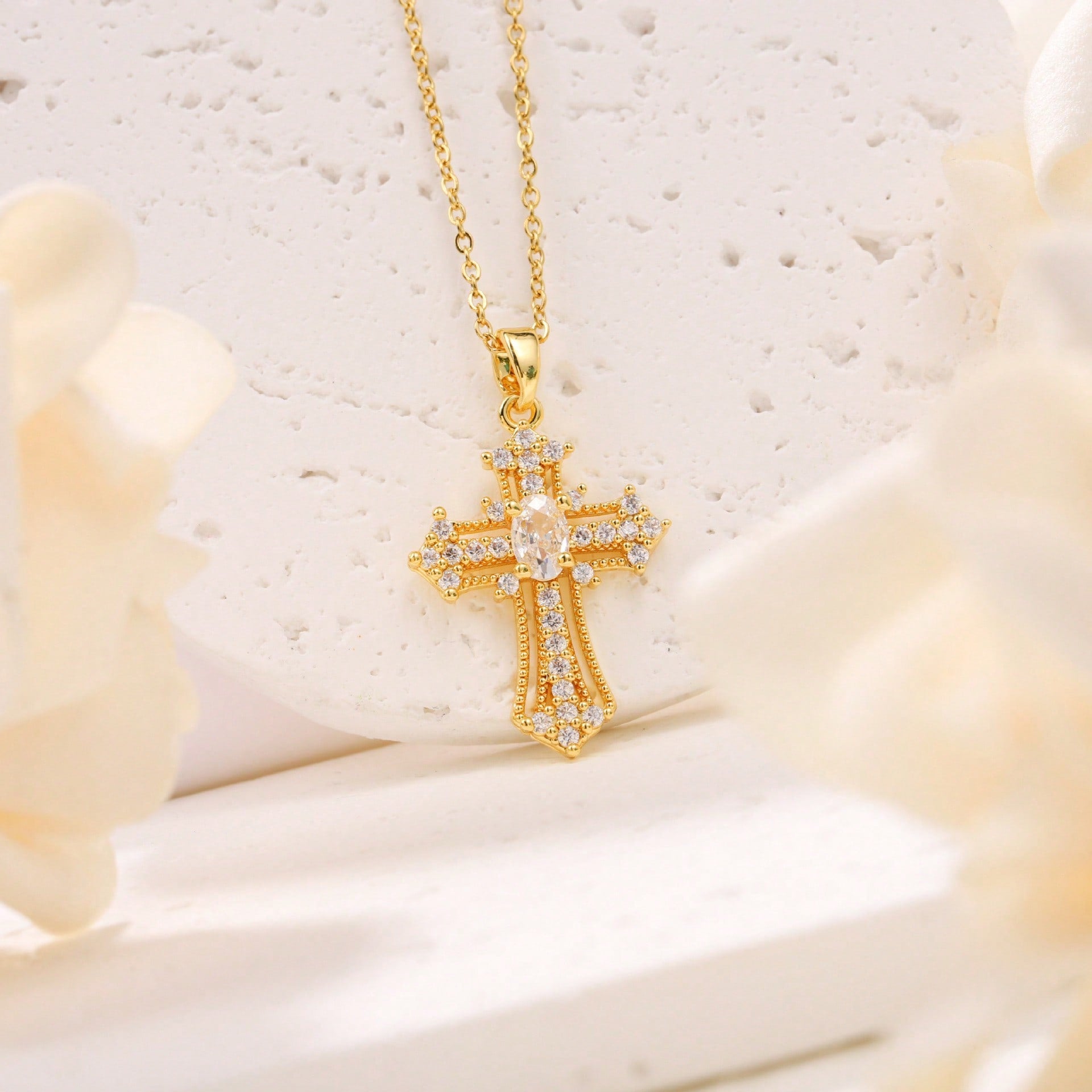 Elegant Gold Tone Cross Pendant Necklace With Sparkling Cubic Zirconia – Exquisite Religious Jewelry Featuring Ornate Cross Design Adorned With Brilliant Cubic Zirconia Stones, Including A Larger Oval Center Stone – High-Quality Gold Tone Finish For Timel