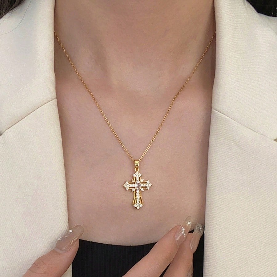 Elegant Gold Tone Cross Pendant Necklace With Sparkling Cubic Zirconia – Exquisite Religious Jewelry Featuring Ornate Cross Design Adorned With Brilliant Cubic Zirconia Stones, Including A Larger Oval Center Stone – High-Quality Gold Tone Finish For Timel